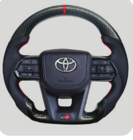 TT AUDIO LC300 STEERING WHEEL - CARBON & RED STITCHING